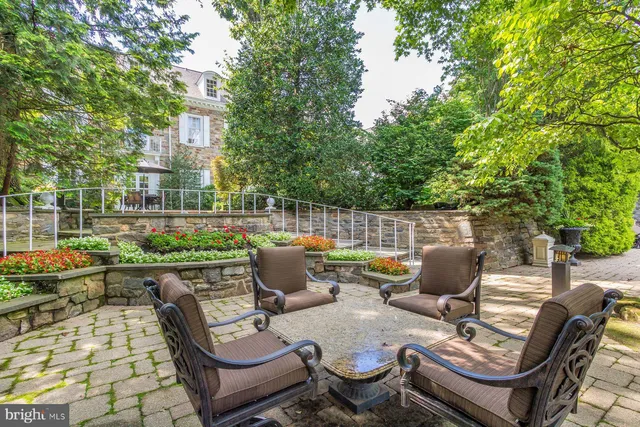 a view of a wooden fence and some plants