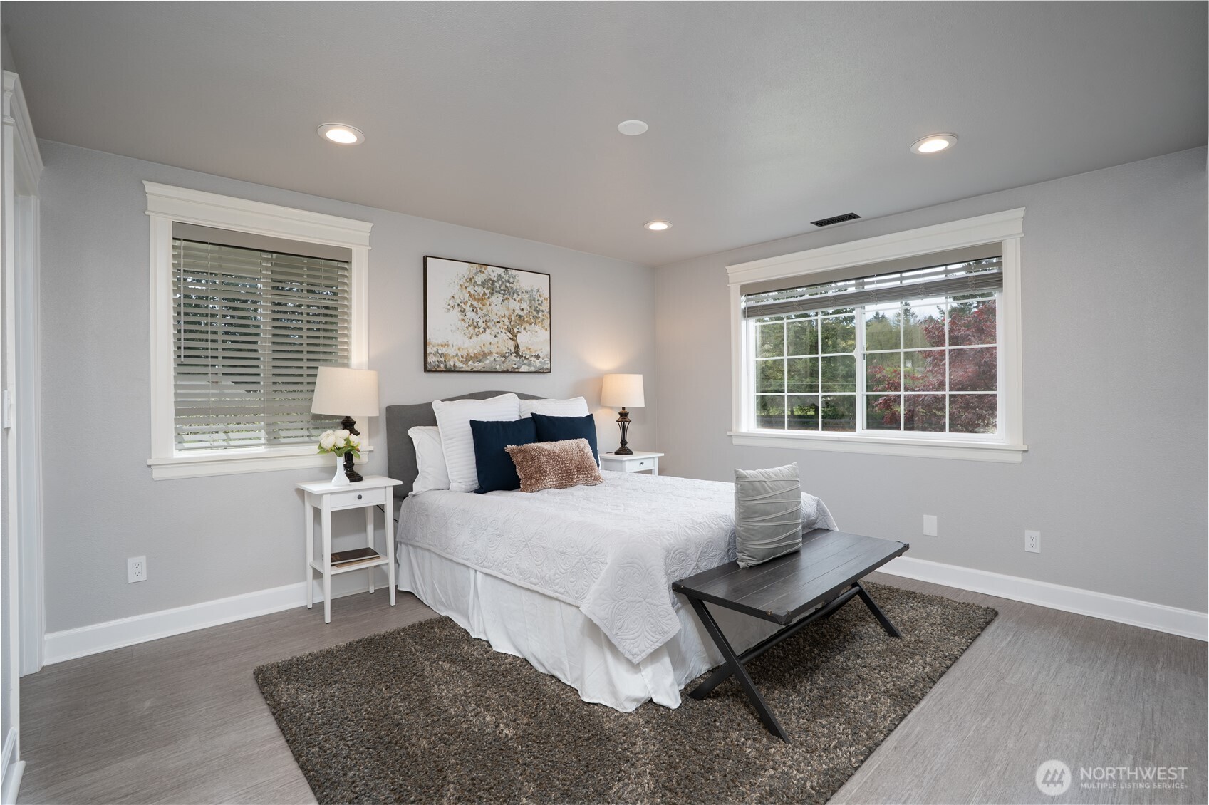 30815 Webster Road East Eatonville, WA 98328 - Photo 14 of 40 a bedroom with a bed and wooden floor