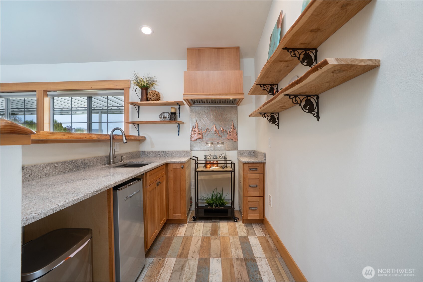 30815 Webster Road East Eatonville, WA 98328 - Photo 23 of 40 a kitchen with stainless steel appliances granite countertop a sink stove and refrigerator