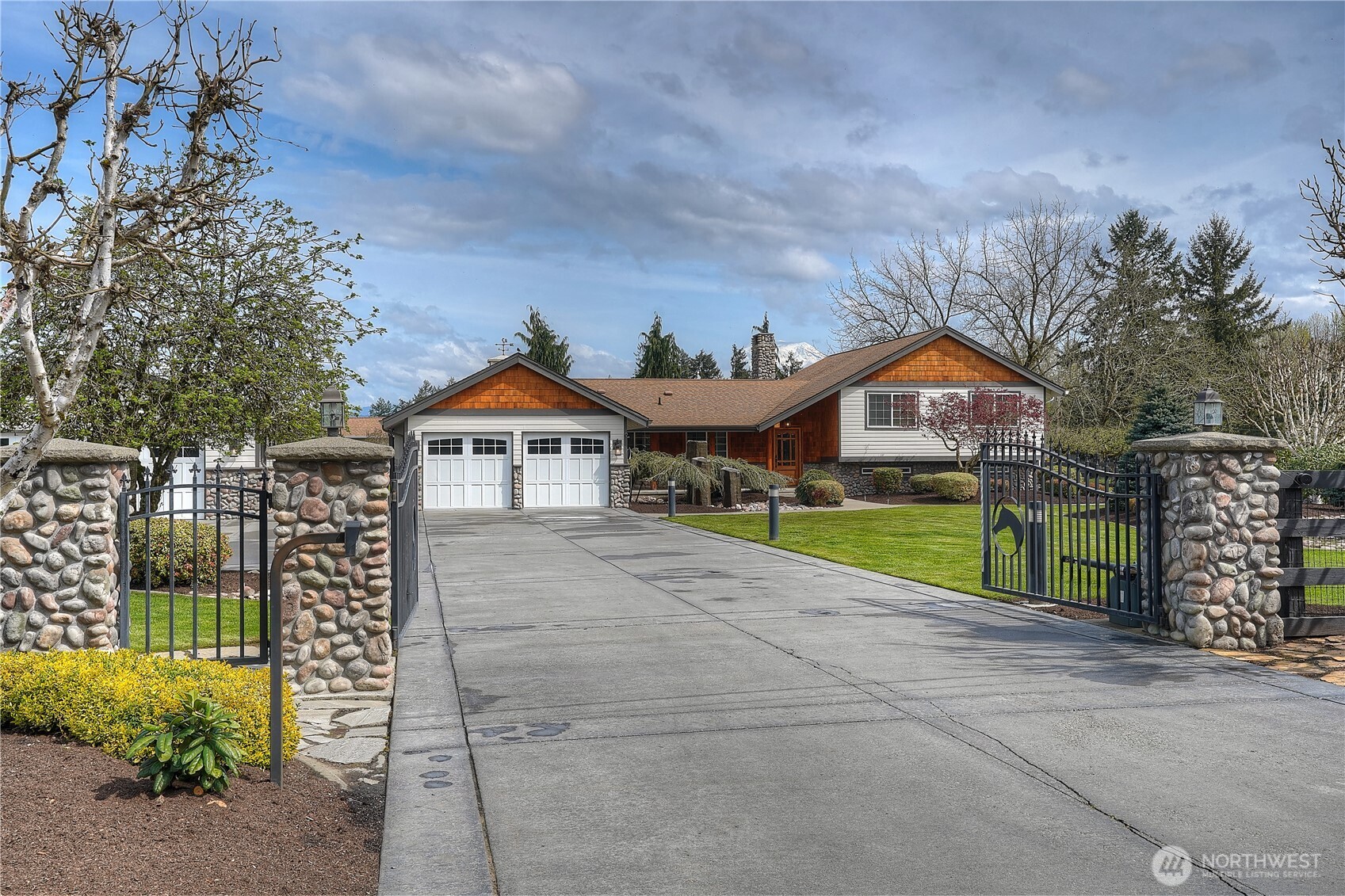 30815 Webster Road East Eatonville, WA 98328 - Photo 35 of 40 a front view of a house with a yard and potted plants