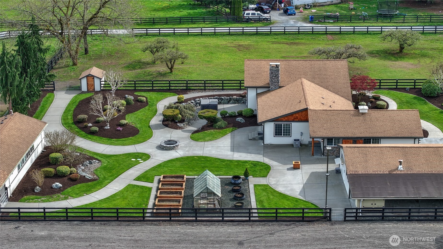 30815 Webster Road East Eatonville, WA 98328 - Photo 4 of 40 an aerial view of a house with a garden and lake view