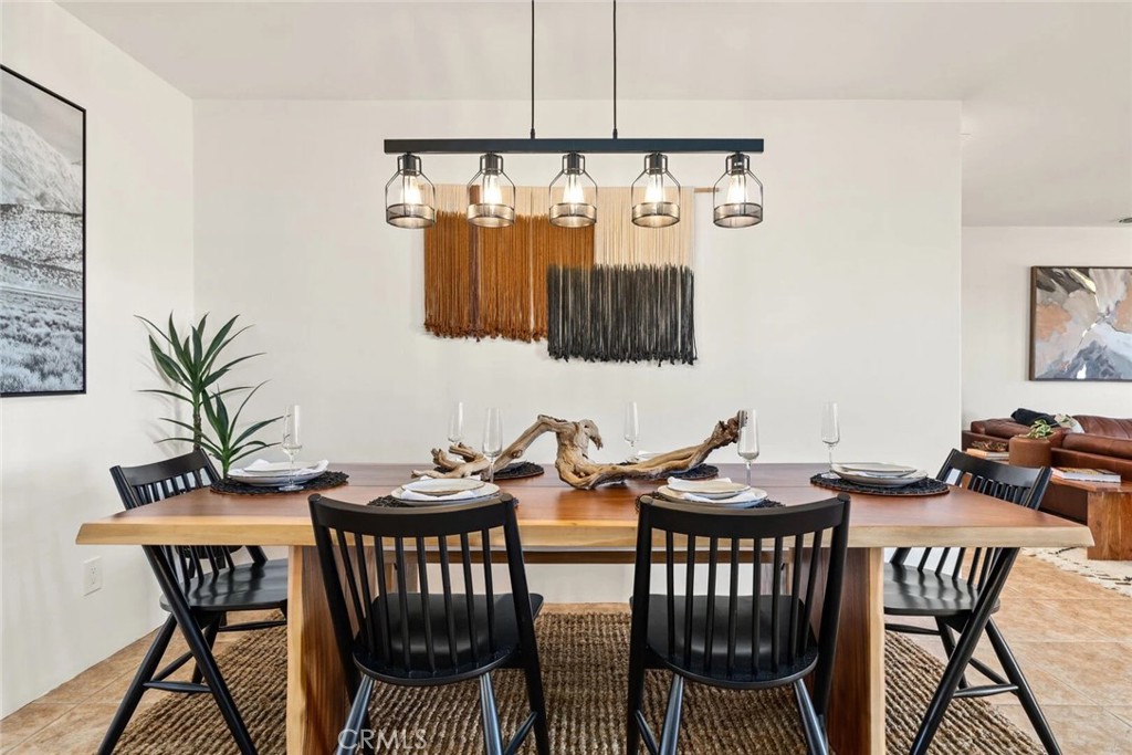 7030 Mile Square Road Joshua Tree, CA 92252 - Photo 16 of 58 a view of a dining room with furniture