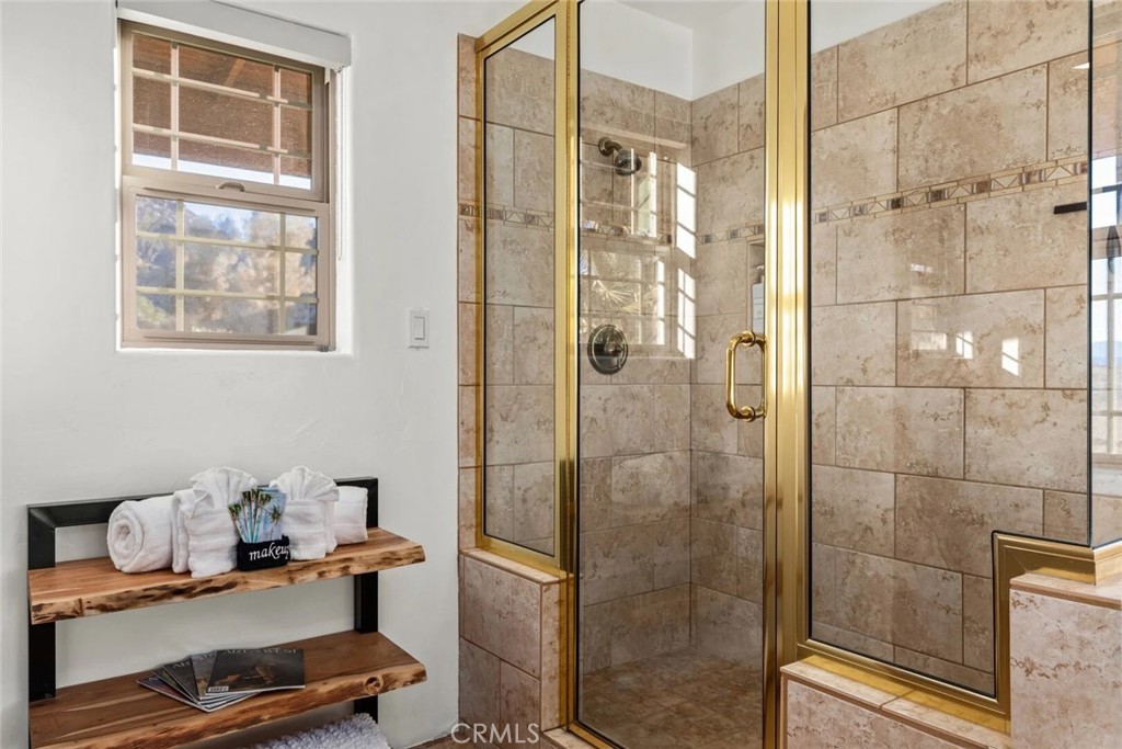 7030 Mile Square Road Joshua Tree, CA 92252 - Photo 26 of 58 a bathroom with a window