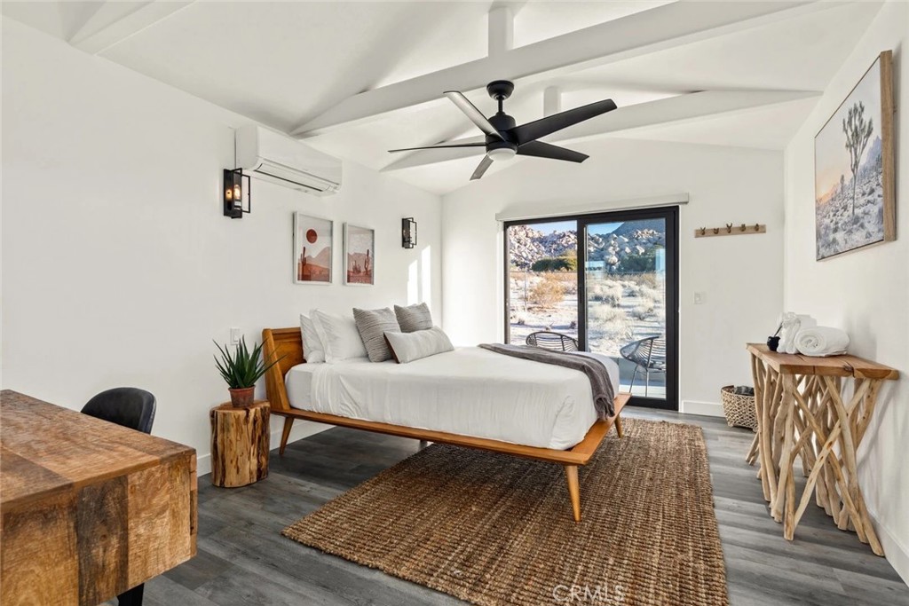 7030 Mile Square Road Joshua Tree, CA 92252 - Photo 54 of 58 a living room with furniture and wooden floor
