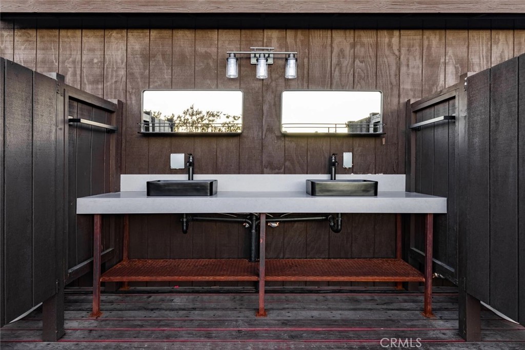 7030 Mile Square Road Joshua Tree, CA 92252 - Photo 58 of 58 a bathroom with a sink vanity and a mirror