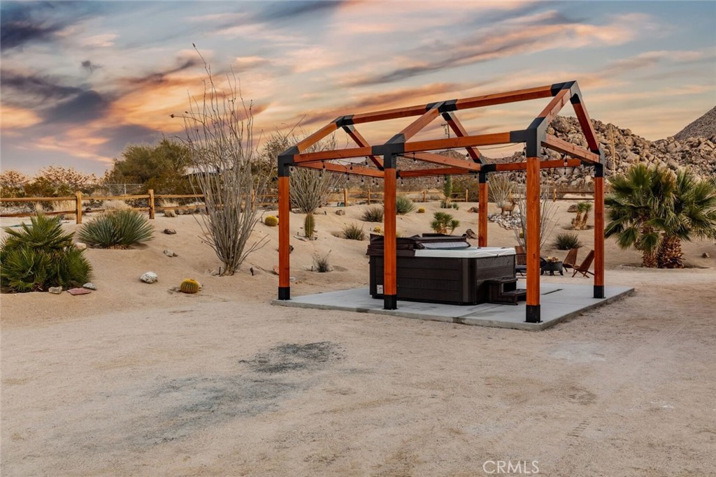 7030 Mile Square Road Joshua Tree, CA 92252 - Photo 6 of 58 a view of a house with a snow in a yard