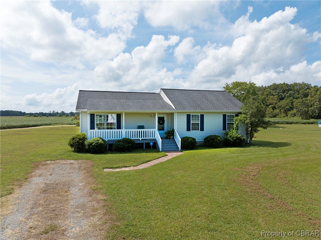 118 Edwards Court Dutton, VA 23050 - Photo 2 of 24 Ranch-style home with a porch, a front lawn, and a rural view