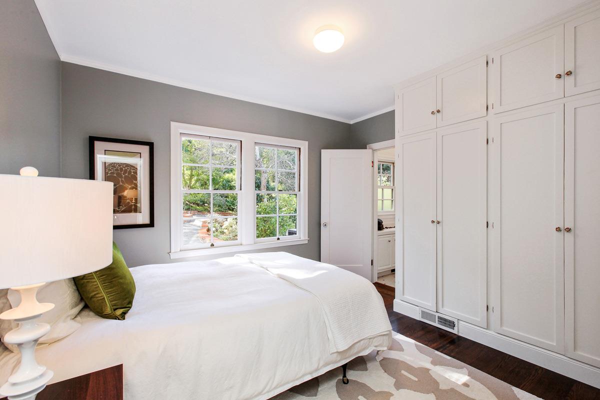 973 Baileyana Road Hillsborough, CA 94010 - Photo 16 of 35 a spacious bedroom with a bed and a window