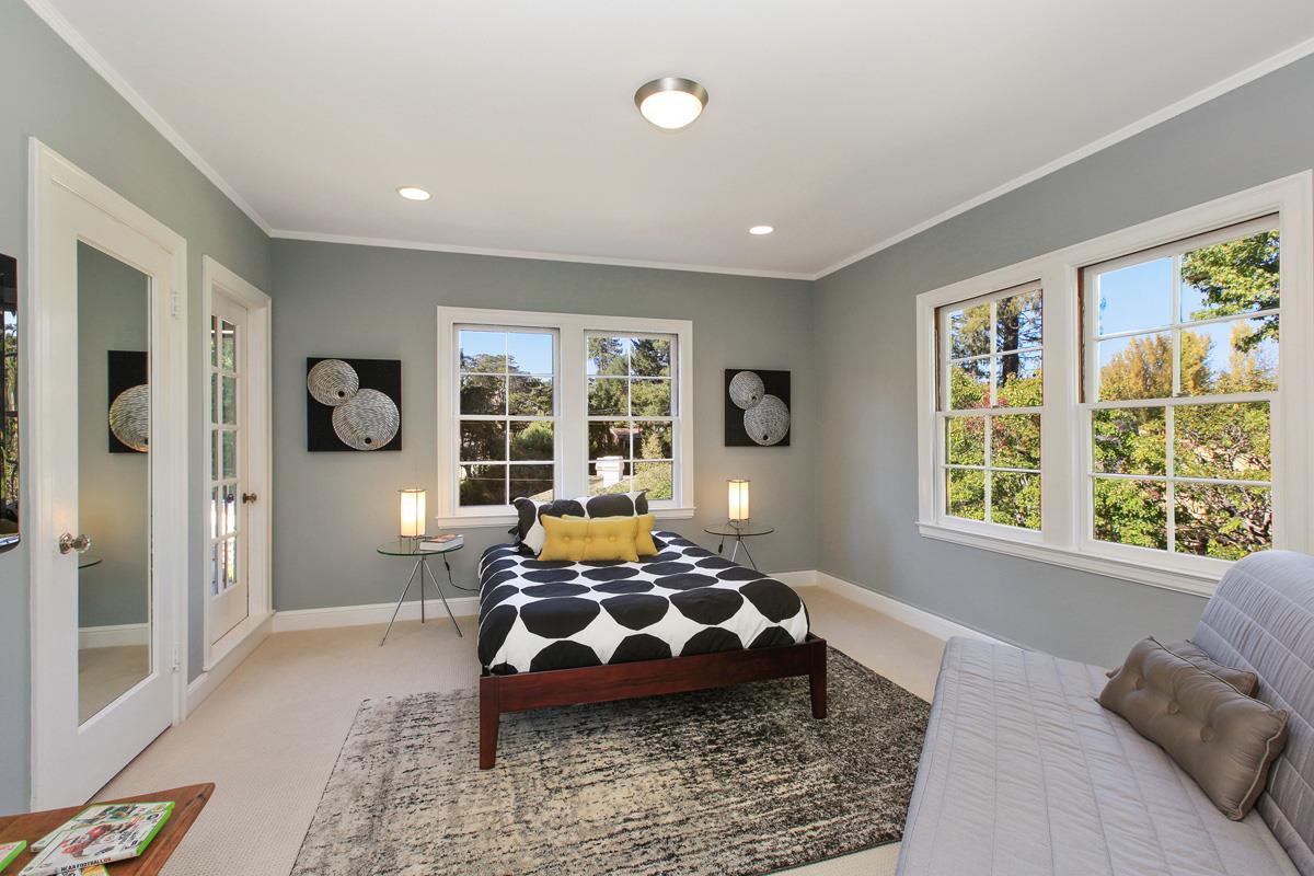 973 Baileyana Road Hillsborough, CA 94010 - Photo 20 of 35 a bedroom with a bed and wooden floor