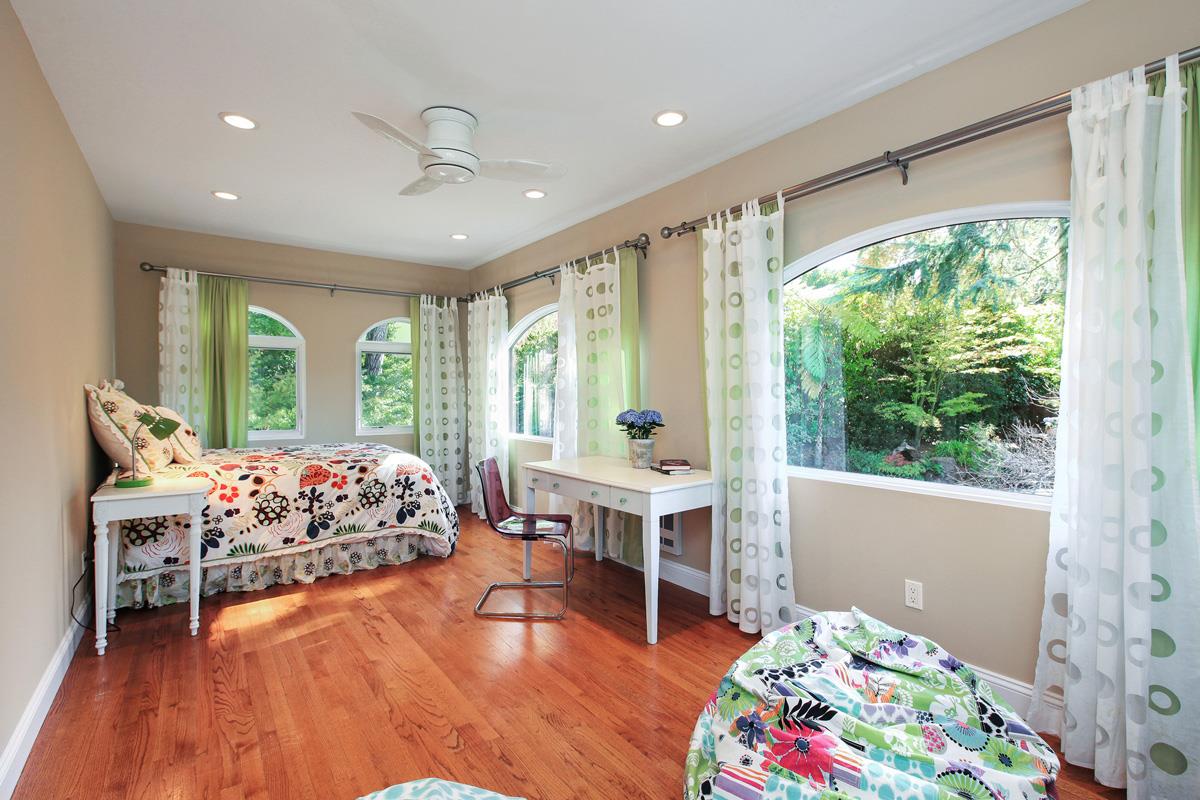 973 Baileyana Road Hillsborough, CA 94010 - Photo 23 of 35 a bedroom with furniture and windows