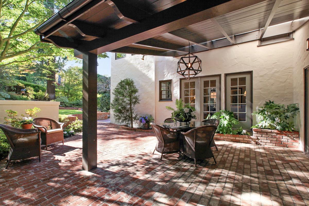 973 Baileyana Road Hillsborough, CA 94010 - Photo 33 of 35 a view of a patio with table and chairs potted plants with wooden floor