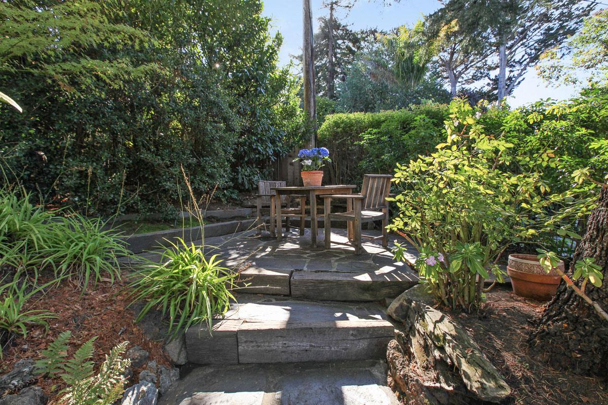 973 Baileyana Road Hillsborough, CA 94010 - Photo 35 of 35 a view of a patio with table and chairs potted plants and large tree