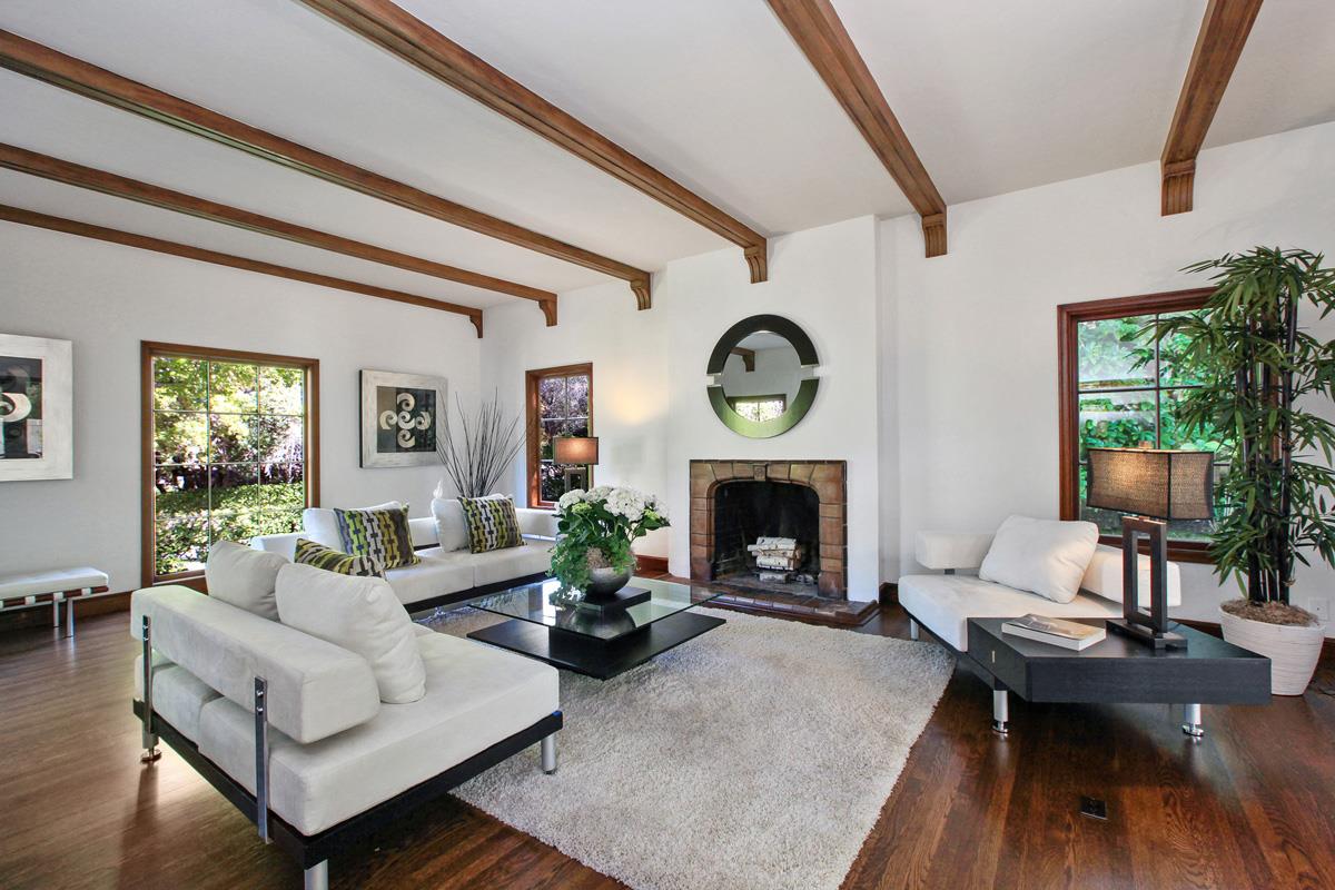 973 Baileyana Road Hillsborough, CA 94010 - Photo 8 of 35 a living room with furniture a fireplace and a table