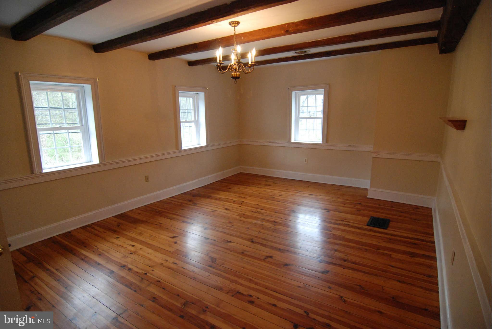 12516 Big Pool Road Clear Spring, MD 21722 - Photo 16 of 30 a view of an empty room with wooden floor and a window