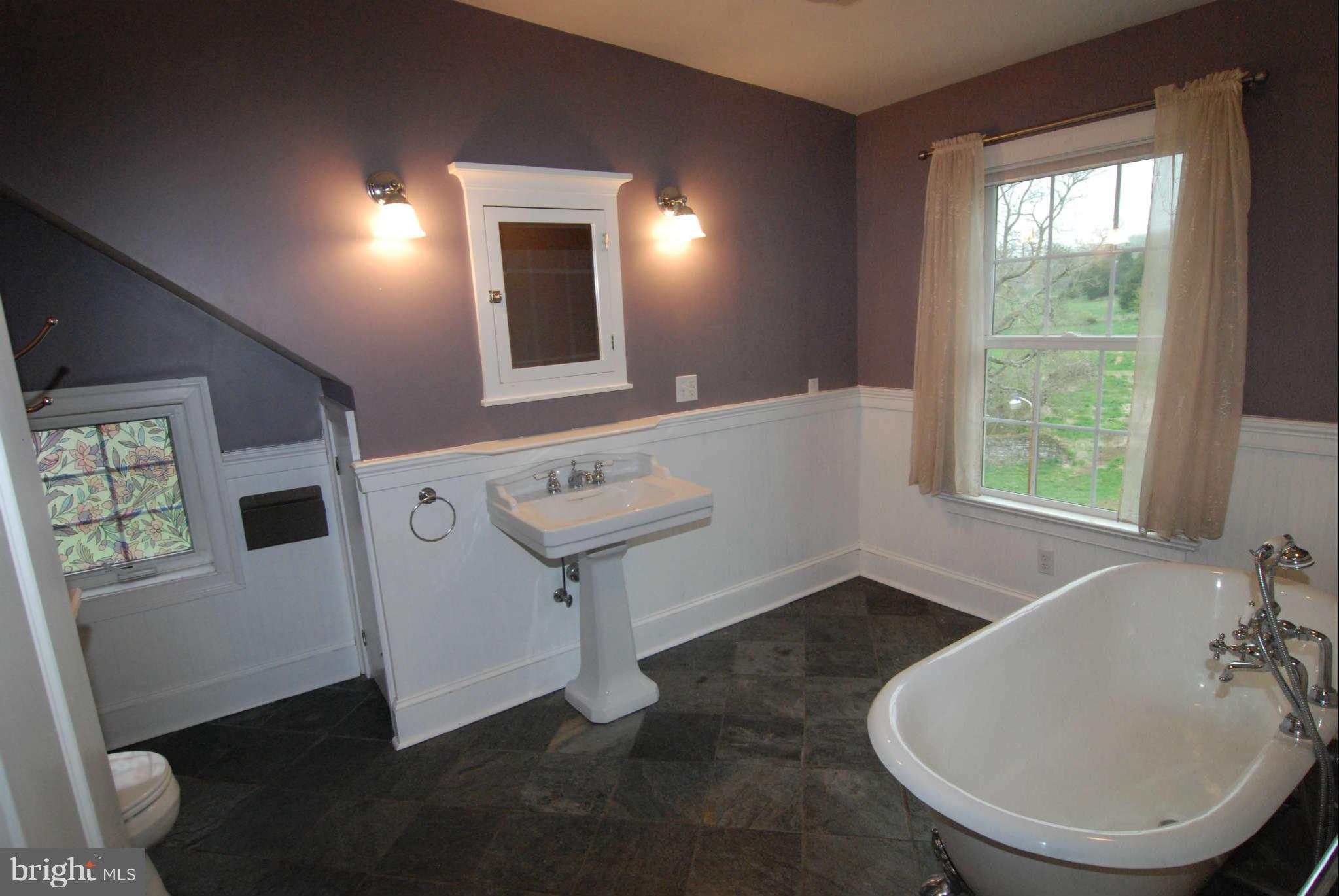 12516 Big Pool Road Clear Spring, MD 21722 - Photo 23 of 30 a bathroom with a sink toilet and mirror