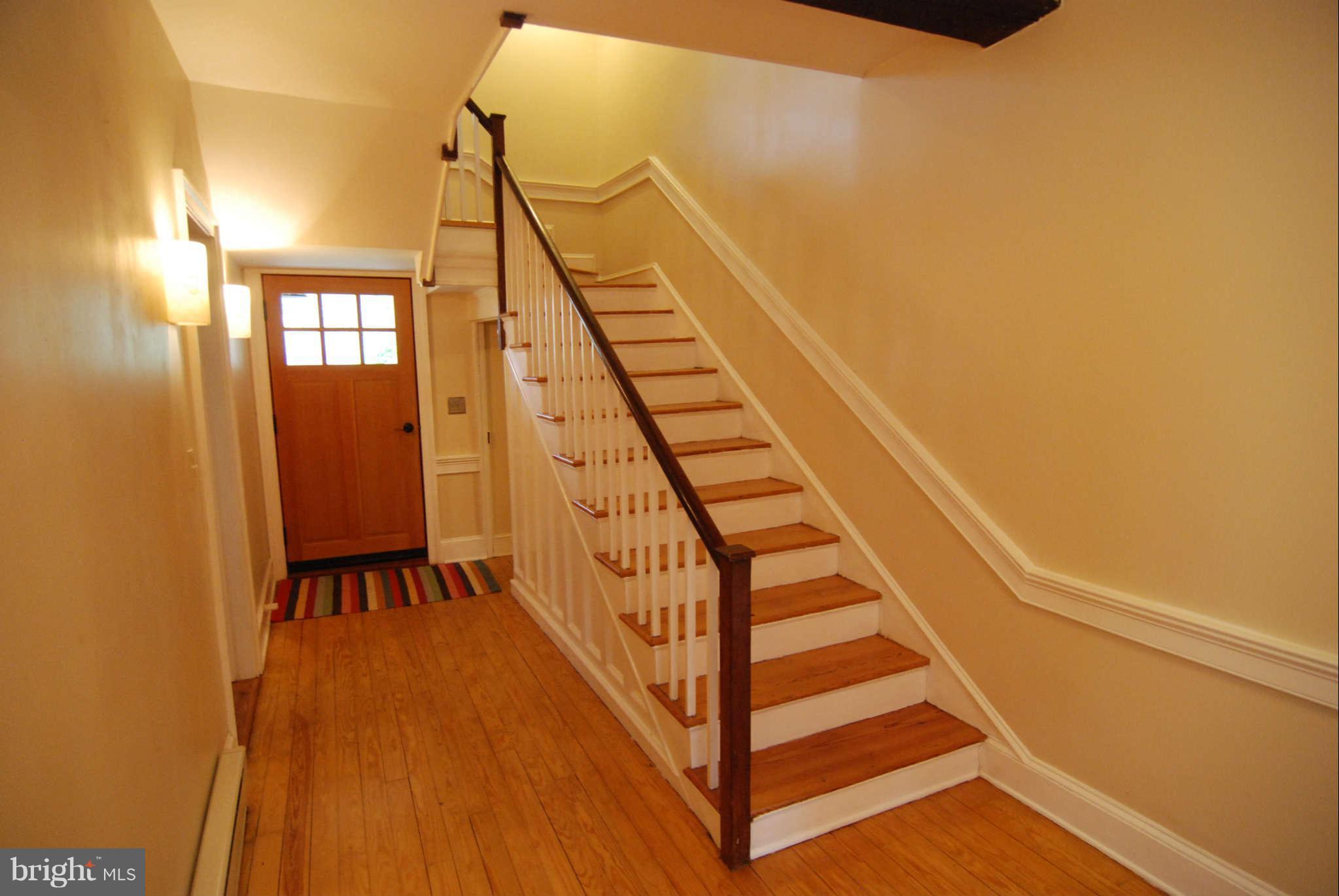 12516 Big Pool Road Clear Spring, MD 21722 - Photo 4 of 30 a view of a staircase with wooden floor and white walls