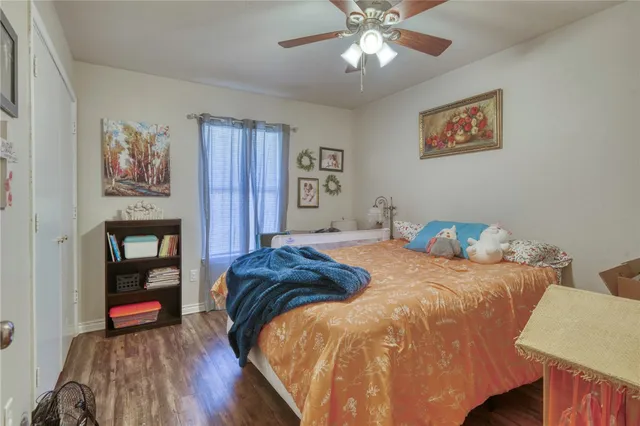 a bedroom with a bed and a bookshelf