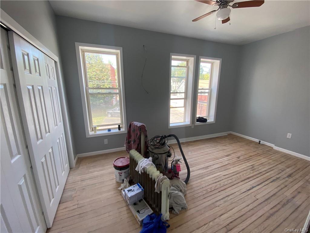 117 North Street, Unit 2 Middletown, NY 10940 - Photo 3 of 5 a view of a room with wooden floor and windows