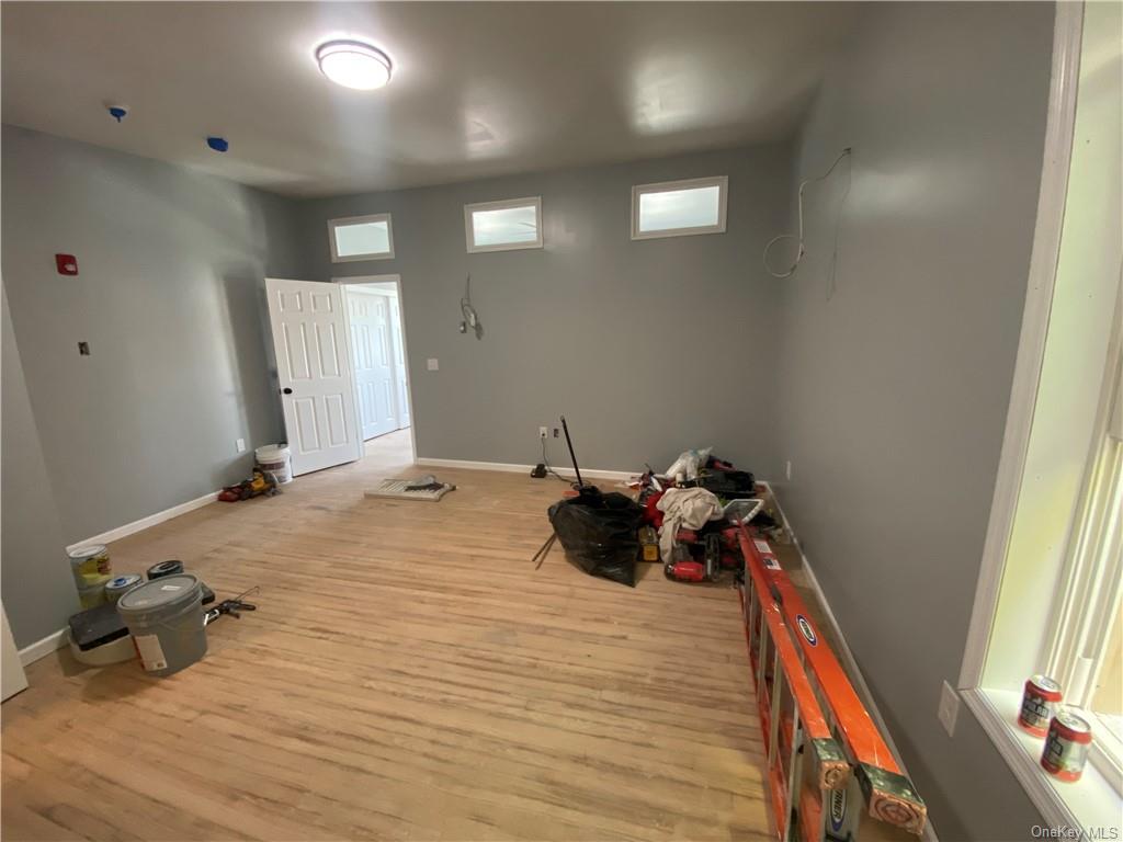 117 North Street, Unit 2 Middletown, NY 10940 - Photo 4 of 5 a bed room with a bed and a window