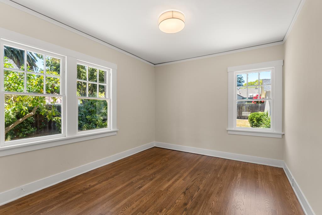 395 Loreto Street Mountain View, CA 94041 - Photo 16 of 28 a view of an empty room with wooden floor and a window