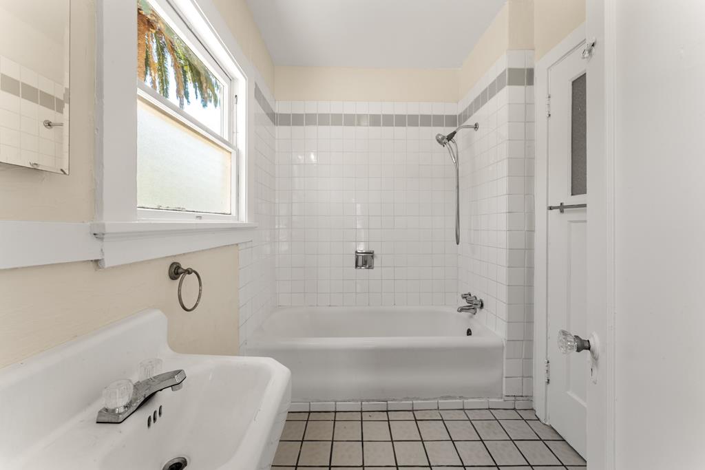 395 Loreto Street Mountain View, CA 94041 - Photo 18 of 28 a bathroom with a granite countertop bathtub shower and mirror