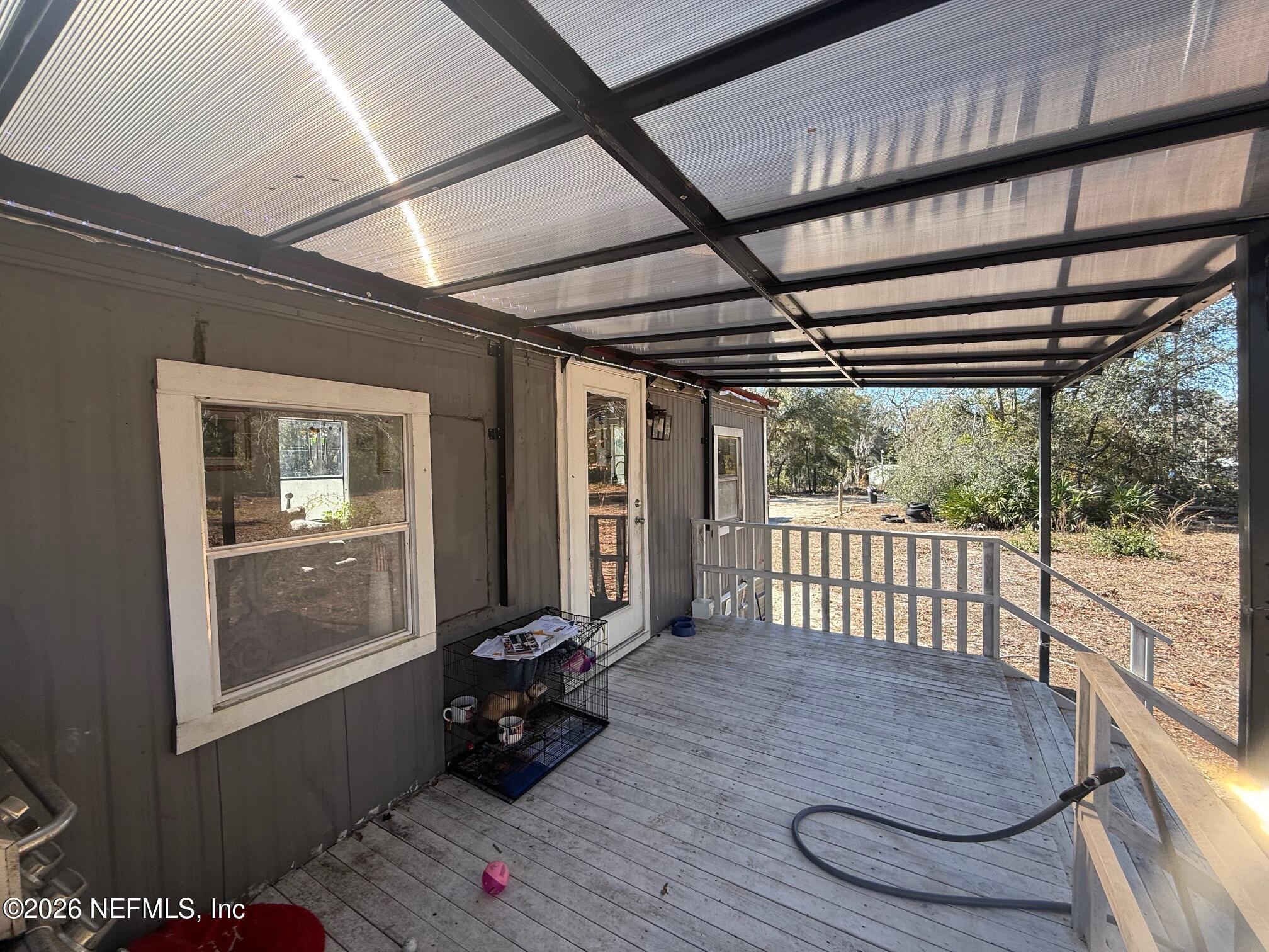 104 Churchill Street Interlachen, FL 32148 - Photo 18 of 24 a living room with wooden floor