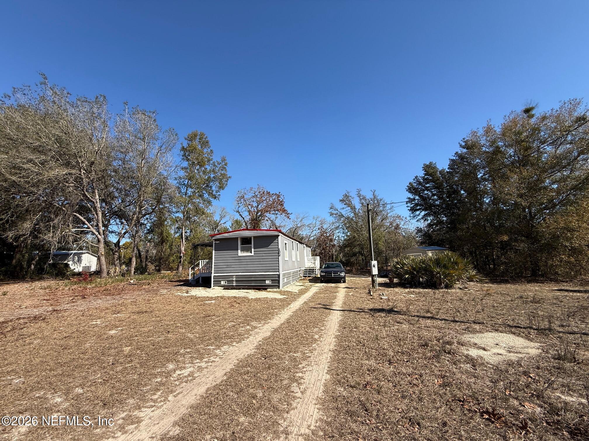 104 Churchill Street Interlachen, FL 32148 - Photo 3 of 24 a view of a city street with a building