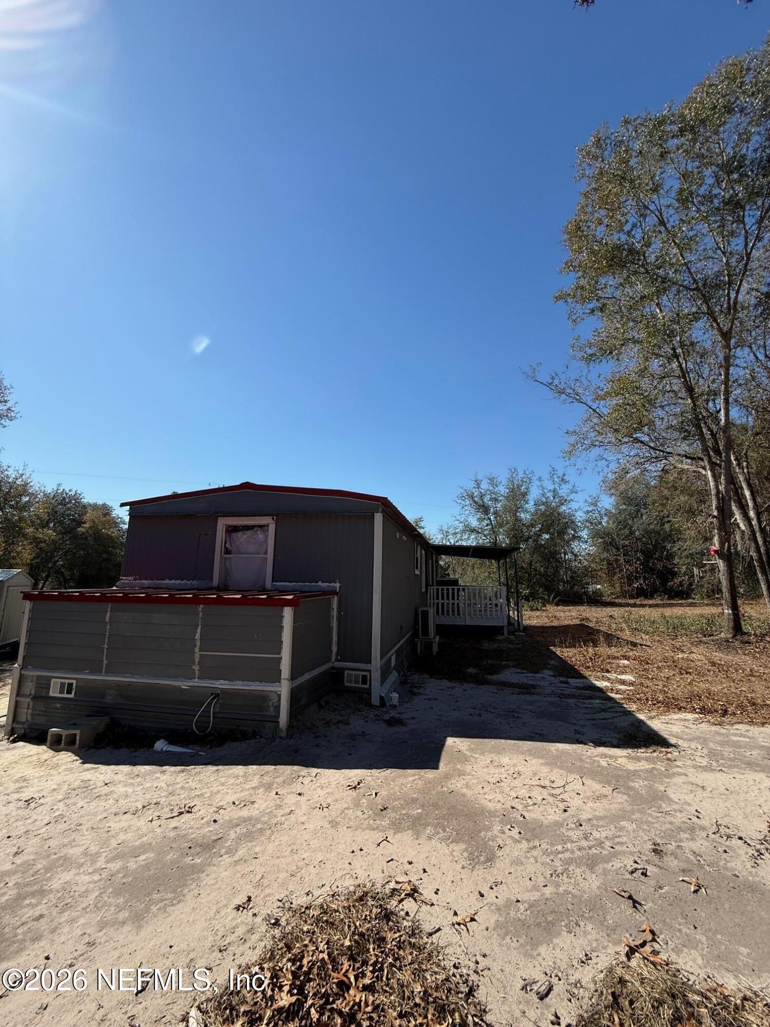104 Churchill Street Interlachen, FL 32148 - Photo 4 of 24 a view of a house with a yard