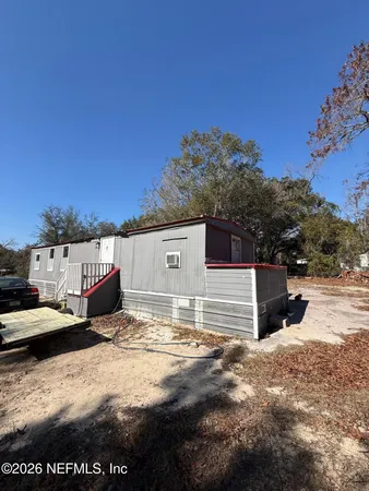 a view of a parking space in the middle of a yard