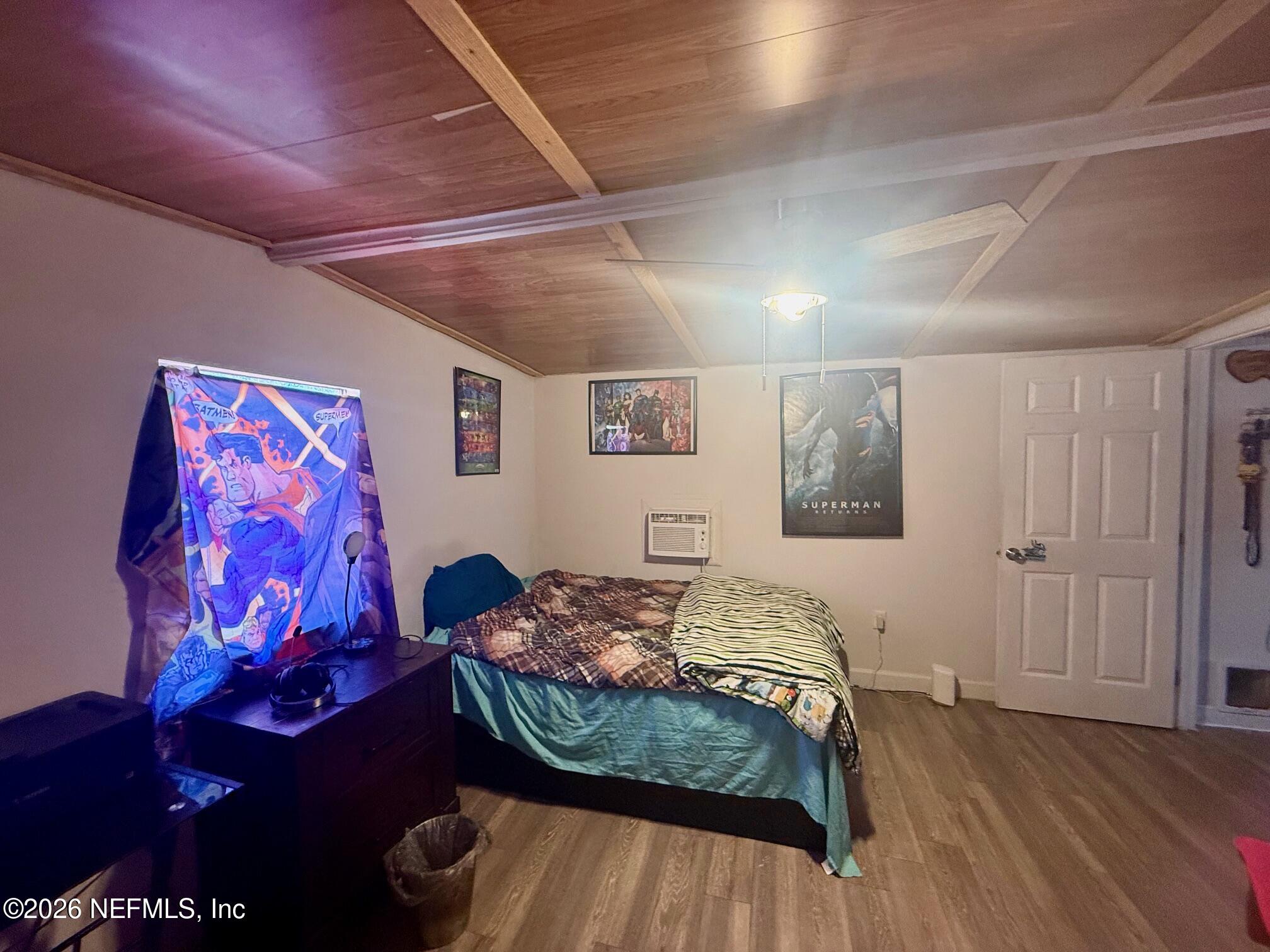 104 Churchill Street Interlachen, FL 32148 - Photo 7 of 24 a bedroom with bed and a window