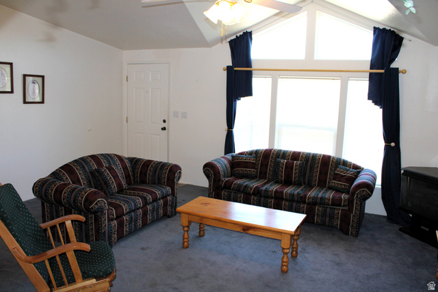 22580 Spring Creek Drive, Unit B61 Fairview, UT 84629 - Photo 10 of 39 Living space featuring vaulted ceilings, a ceiling fan with light fixture, and multiple large windows with transom panels