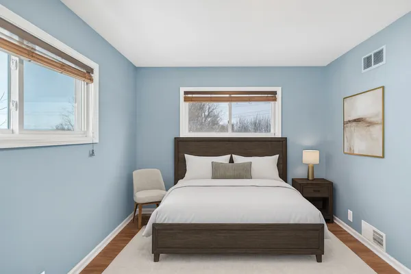 a bedroom with a bed and window