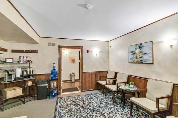 a living room with furniture and a rug