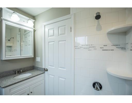 19 Laconia Avenue Saugus, MA 01906 - Photo 16 of 27 a bathroom with a tub shower vanity and mirror