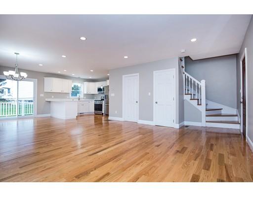 19 Laconia Avenue Saugus, MA 01906 - Photo 3 of 27 a view of empty room with wooden floor and kitchen