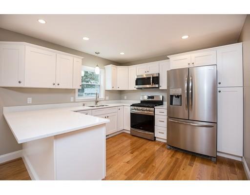 19 Laconia Avenue Saugus, MA 01906 - Photo 5 of 27 a kitchen with kitchen island a sink stainless steel appliances and cabinets