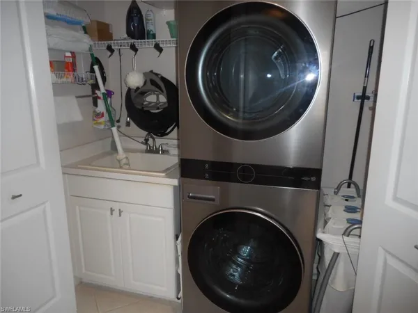 a large bed sitting in a bedroom next to a window