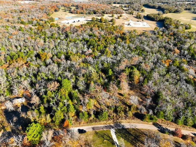 an aerial view of residential house with parking space