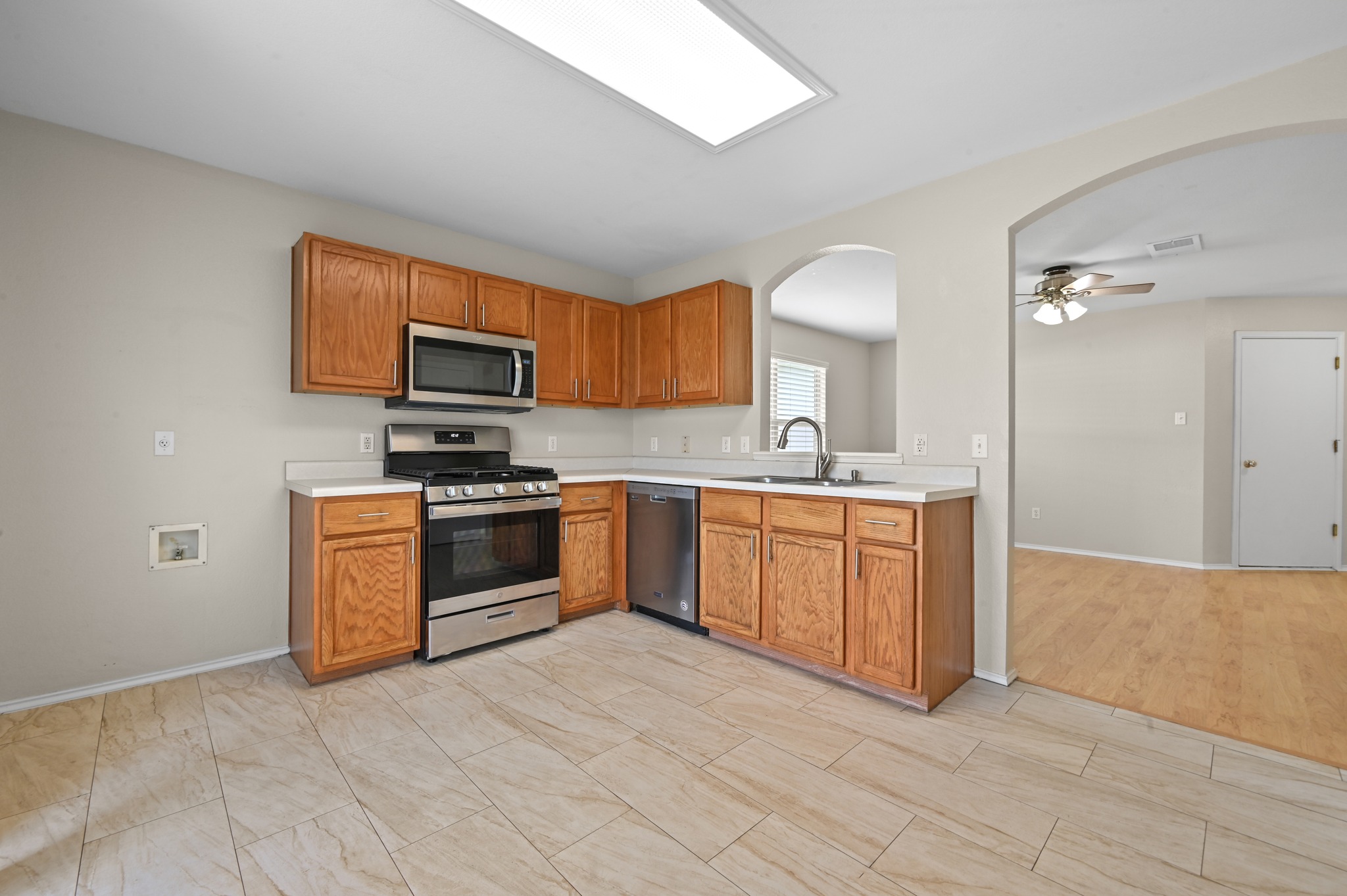 112 Mason Reed Cove Kyle, TX 78640 - Photo 11 of 26 a kitchen with a sink cabinets and stainless steel appliances