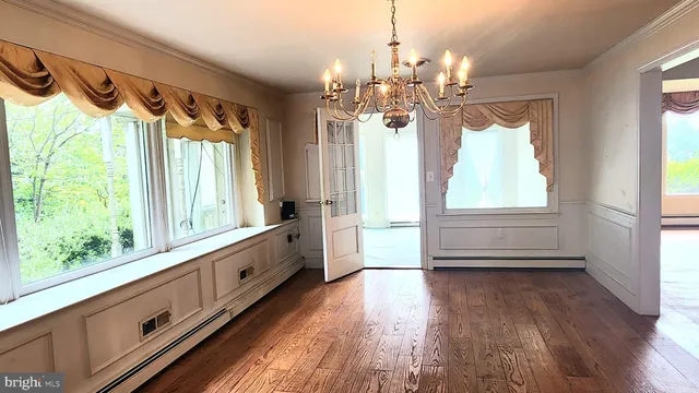 a view of a house with wooden floor and windows