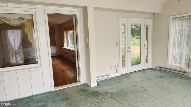 a view of a room that has a window in it