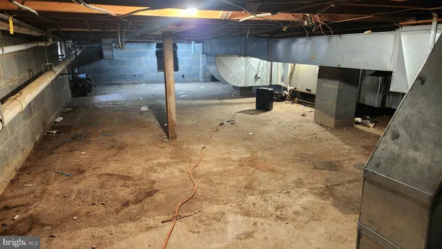 a view of dining room with a table and chairs