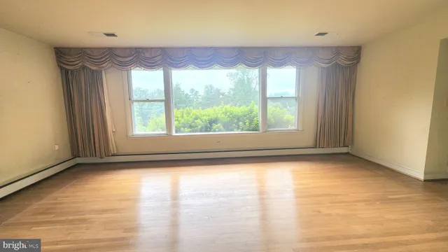 a view of a room with a large window