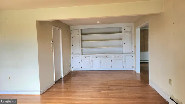 wooden floor in a white room