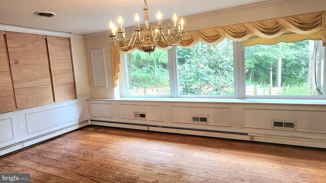 a view of room with window and furniture