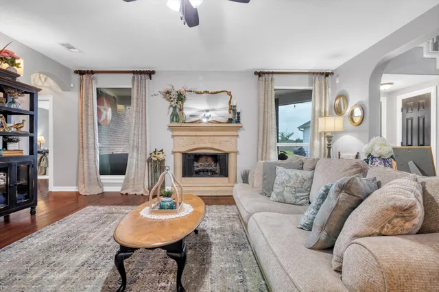 a living room with furniture and a fireplace