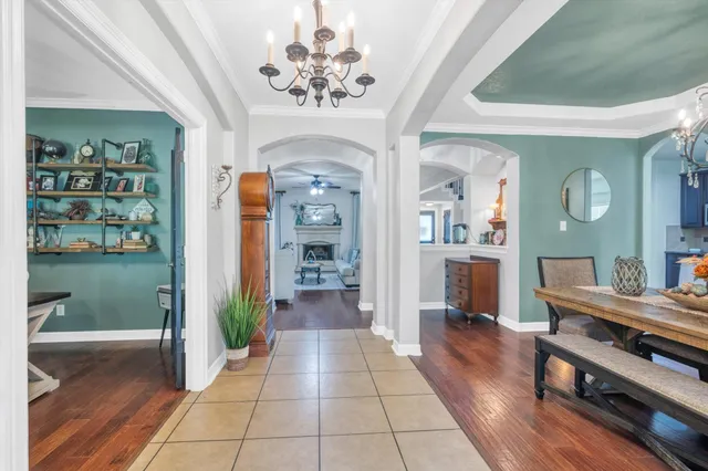 a room with wooden floor and furniture