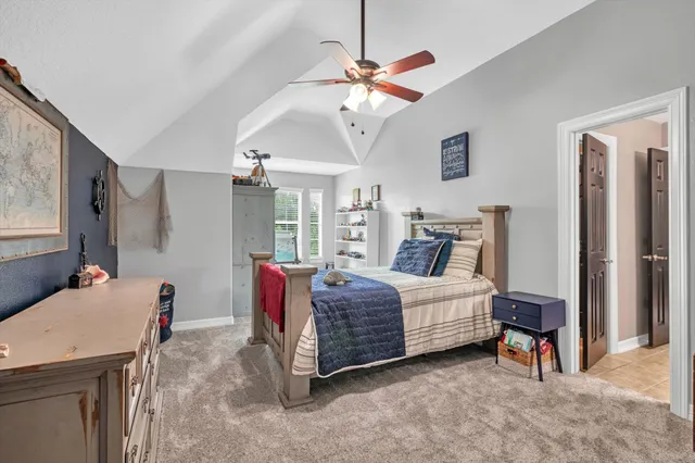 a bed room with a bed and a chandelier