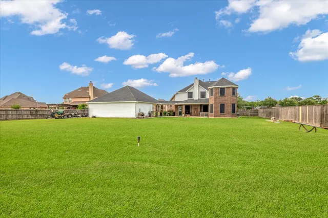 a view of a house with a big yard