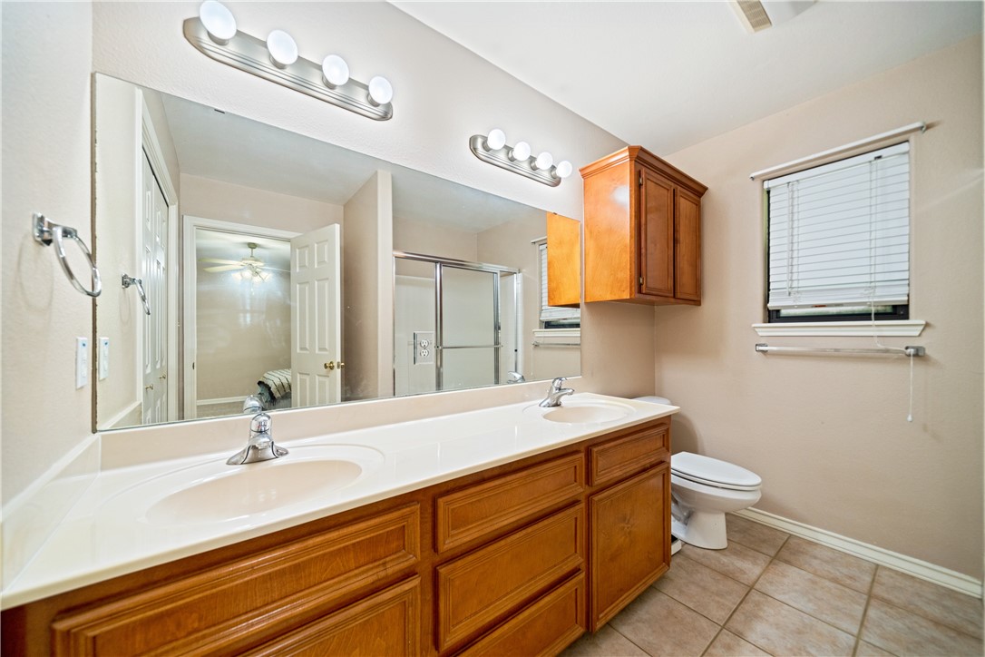 2839 McKinzie Road, Unit 10 Corpus Christi, TX 78410 - Photo 12 of 22 a bath room with a sink and a mirror